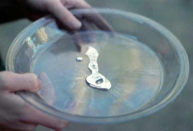 gallium chemical element on a laboratory glass plate